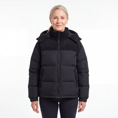 Cord Puffer Jacket för dam i svart, kvinna framifrån mot vit bakgrund