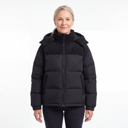 Cord Puffer Jacket voor dames in zwart, vrouw van voren tegen een witte achtergrond