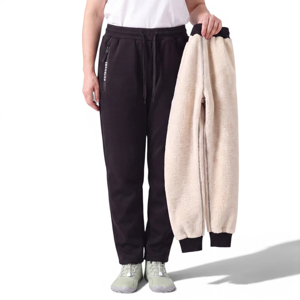 OUTDOORS NORDIC black fleece-lined sweatpants with an elastic drawstring waist and zippered pockets.