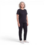 A woman wearing an OUTDOORS NORDIC black quick-dry stretch t-shirt with a cooling ice-silk feel and smooth finish.