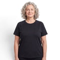 Mature woman wearing a black OUTDOORS NORDIC quick-dry stretch t-shirt with a cooling ice-silk feel.
