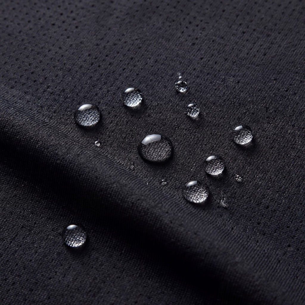 OUTDOORS NORDIC black quick-dry stretch fabric with water-repellent droplets on the textured surface