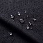 OUTDOORS NORDIC black quick-dry stretch fabric with water-repellent droplets on the textured surface
