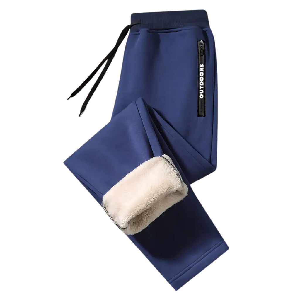 OUTDOORS NORDIC navy blue fleece-lined sweatpants with an elastic drawstring waist and zippered side pocket.
