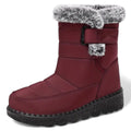 OUTDOORS NORDIC burgundy waterproof winter boots with faux fur trim, warm lining, and non-slip rubber sole.
