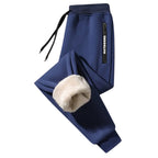 OUTDOORS NORDIC navy blue fleece-lined sweatpants with an elastic drawstring waist and zippered pocket detail.