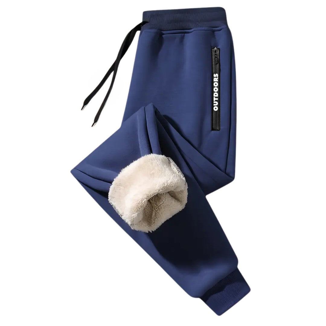 OUTDOORS NORDIC navy blue fleece-lined sweatpants with an elastic drawstring waist and zippered pocket detail.