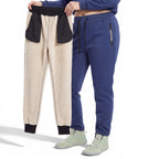 OUTDOORS NORDIC Fleece 24/7 pants in blue and beige with a drawstring waist, zippered pockets, and soft fleece lining.