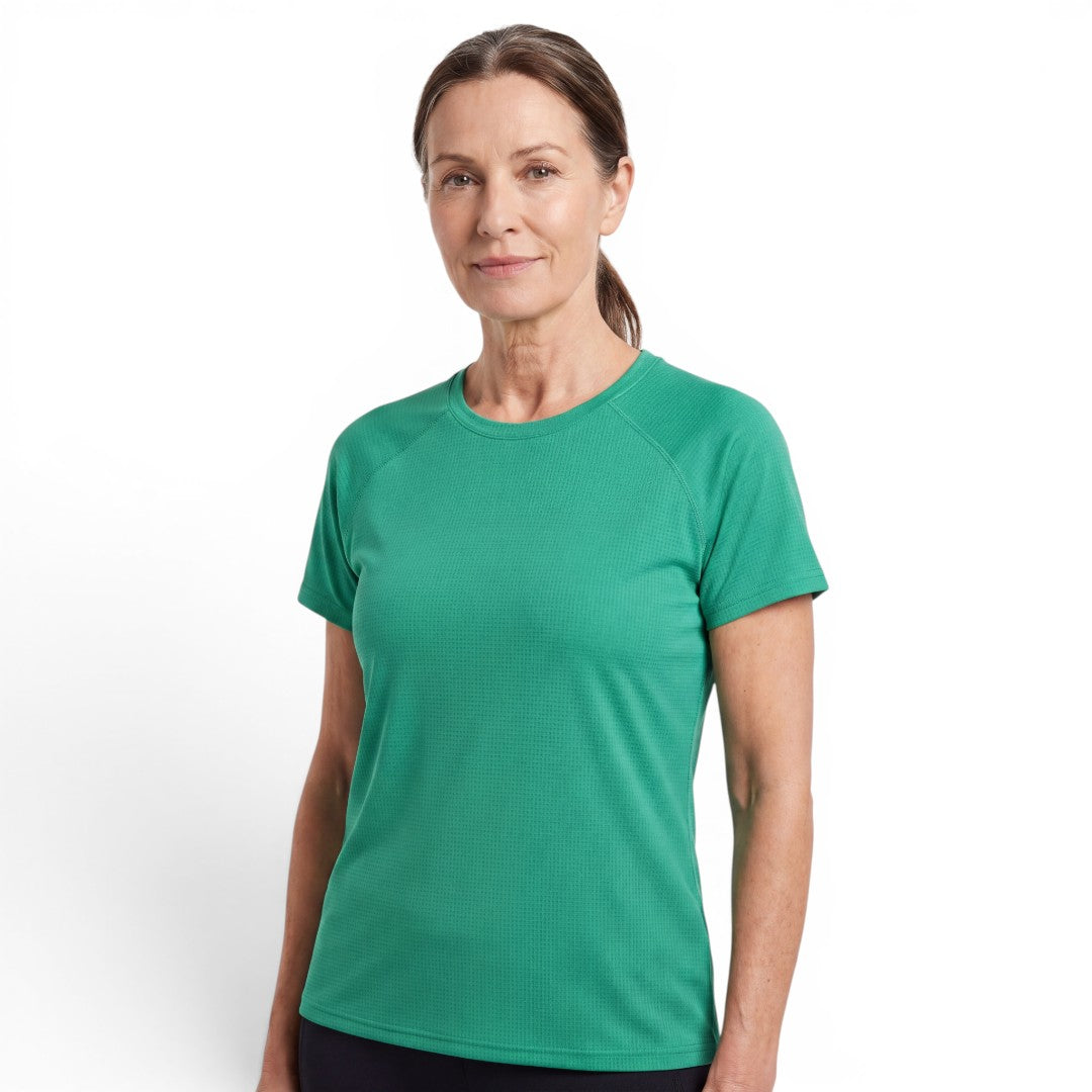 A woman wearing an OUTDOORS NORDIC green quick-dry stretch t-shirt with a smooth, cooling ice-silk texture.