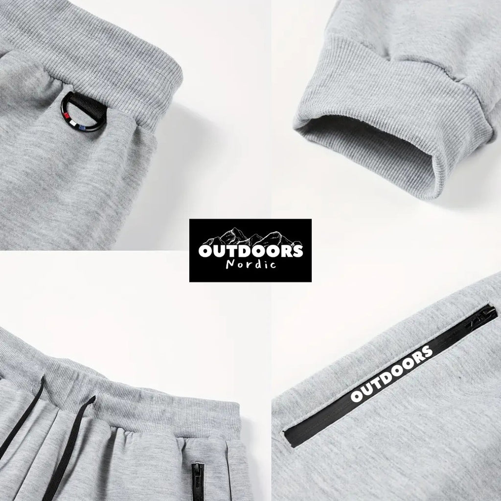 OUTDOORS NORDIC grey fleece 24/7 pants featuring an elastic waist with drawstring, ribbed cuffs, and zippered pockets.