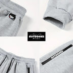 OUTDOORS NORDIC grey fleece 24/7 pants featuring an elastic waist with drawstring, ribbed cuffs, and zippered pockets.