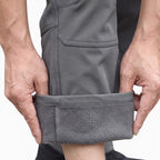 OUTDOORS NORDIC grey utility fleece pants with a soft fleece lining and durable windproof, waterproof stretch fabric.
