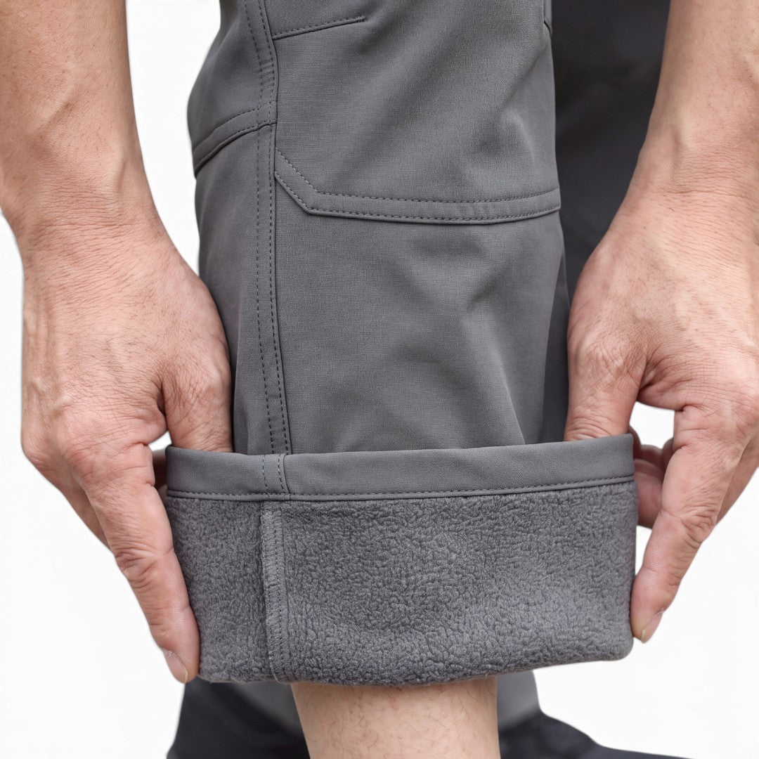 OUTDOORS NORDIC grey utility fleece pants with a soft fleece lining and durable windproof, waterproof stretch fabric.
