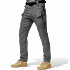 OUTDOORS NORDIC grey utility fleece pants with multiple cargo pockets, windproof and waterproof stretch fabric.