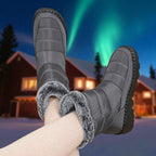 OUTDOORS NORDIC grey waterproof winter boots with faux fur lining and velcro closure worn in a snowy landscape