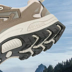OUTDOORS NORDIC low ortho hiking shoe featuring a beige mesh upper and a rugged black TPU grip sole for outdoor trails.