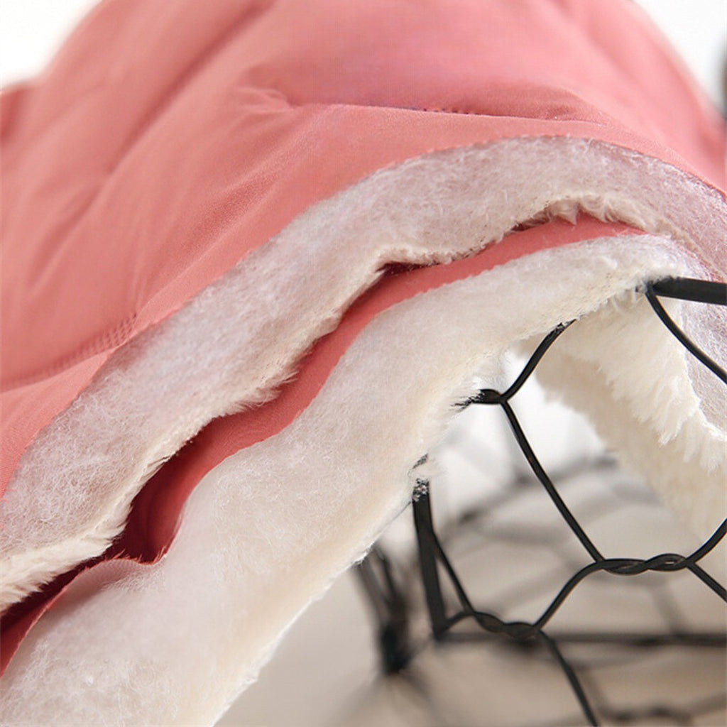 OUTDOORS NORDIC kids' fleece pants featuring a pink water-repellent outer layer and thick, soft white fleece lining.
