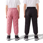 OUTDOORS NORDIC kids' fleece-lined winter pants in pink and black with quilted water-repellent finish, back view.