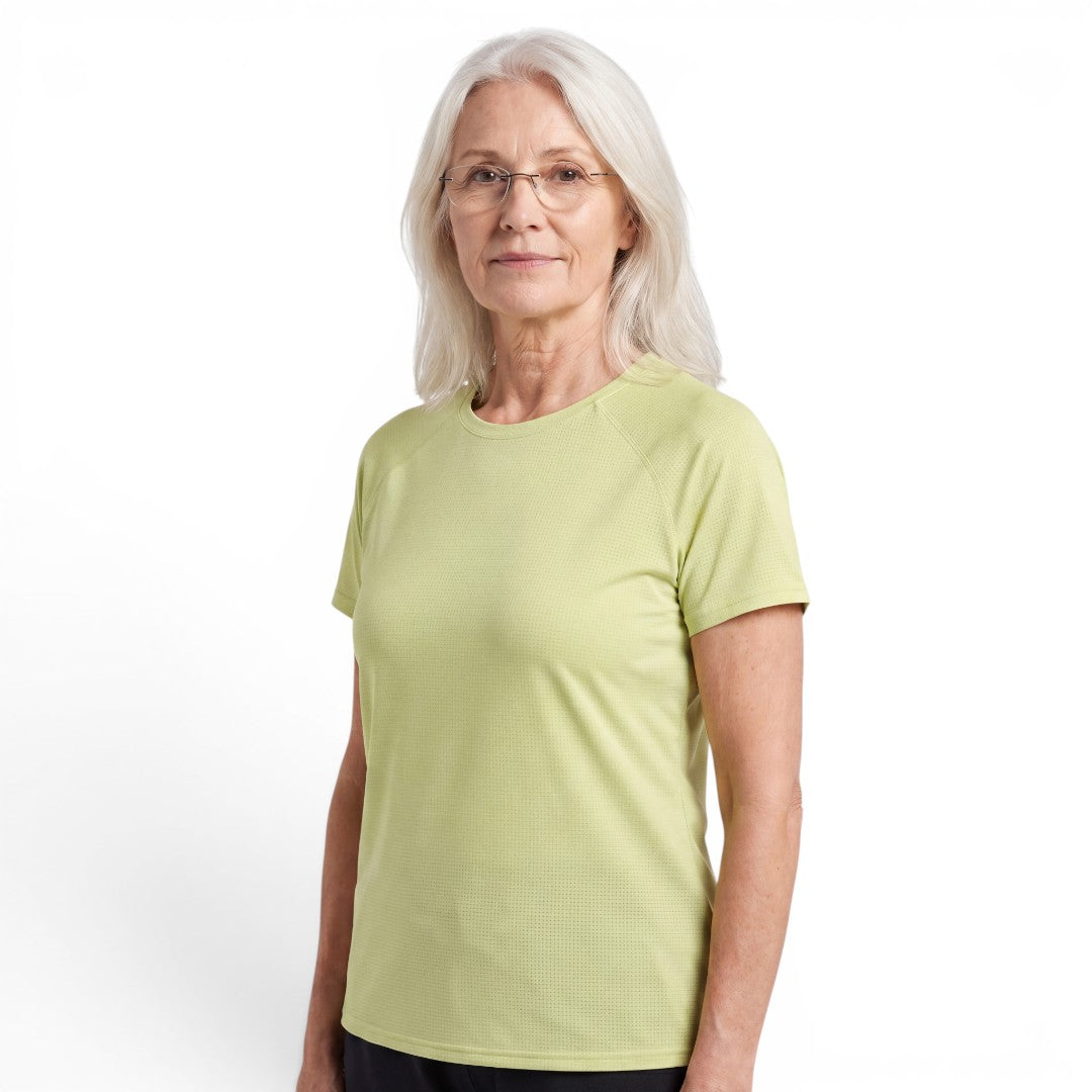 Mature woman wearing a light green OUTDOORS NORDIC quick-dry stretch t-shirt with a smooth ice-silk feel.