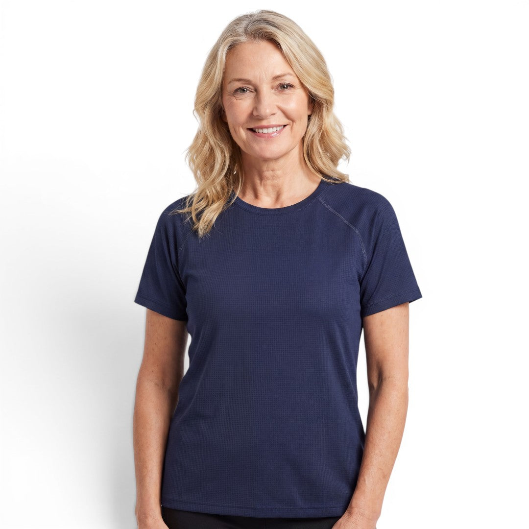 A woman wearing a navy blue OUTDOORS NORDIC quick-dry stretch t-shirt with a smooth, cooling texture.