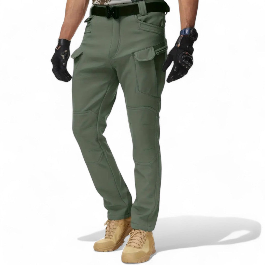 OUTDOORS NORDIC olive green fleece-lined utility pants with multiple cargo pockets and stretch fabric for outdoor use.