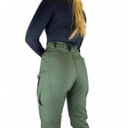 OUTDOORS NORDIC olive green fleece-lined utility pants with multiple pockets on a person, back view.