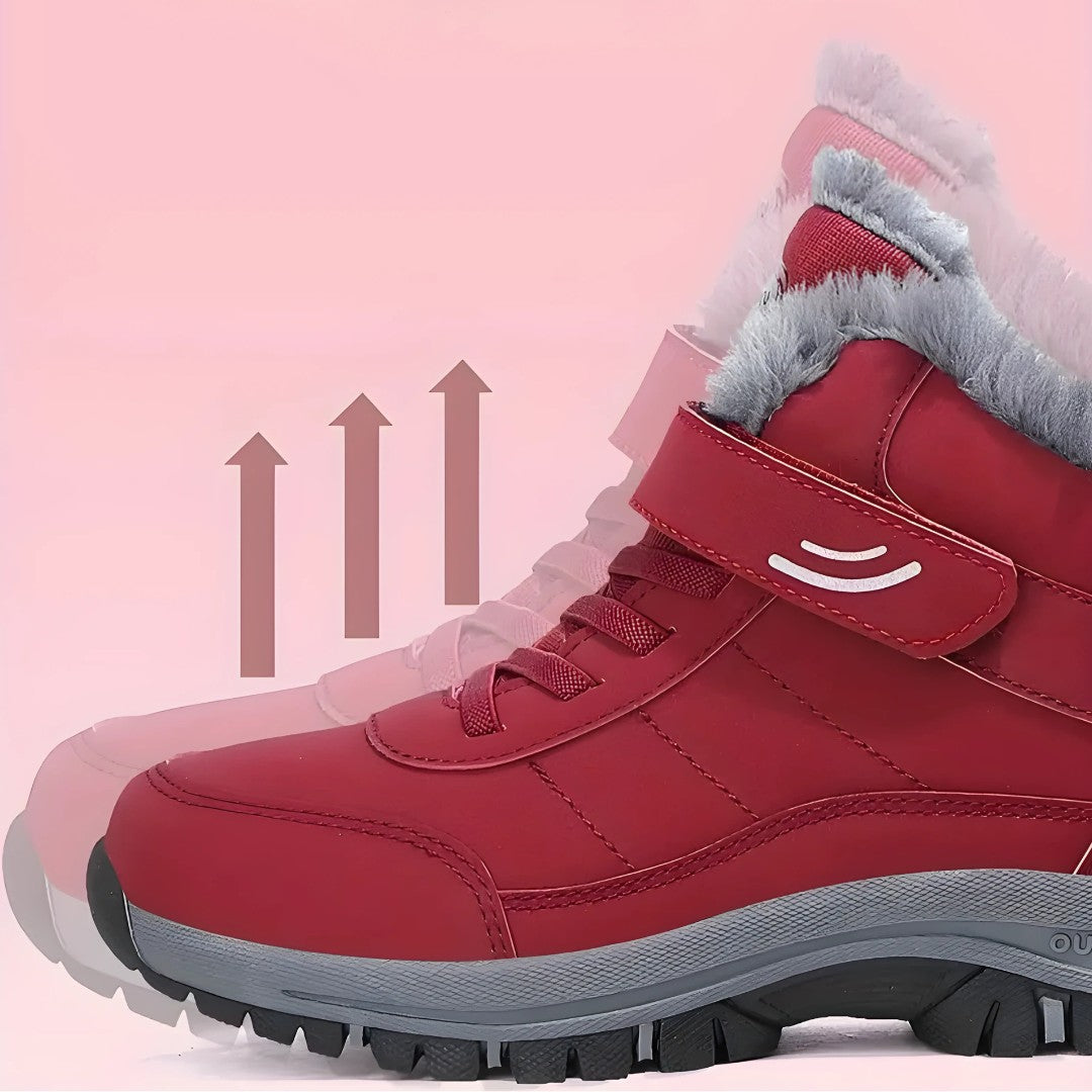 OUTDOORS NORDIC red winter boots with plush lining, velcro strap, and non-slip sole for snowy conditions.