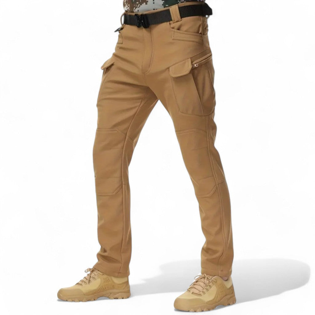 OUTDOORS NORDIC tan utility fleece pants with multiple cargo pockets, windproof and waterproof stretch fabric.
